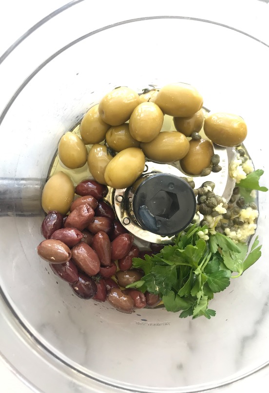 Food Processor with olives, capers, parsley, garlic
