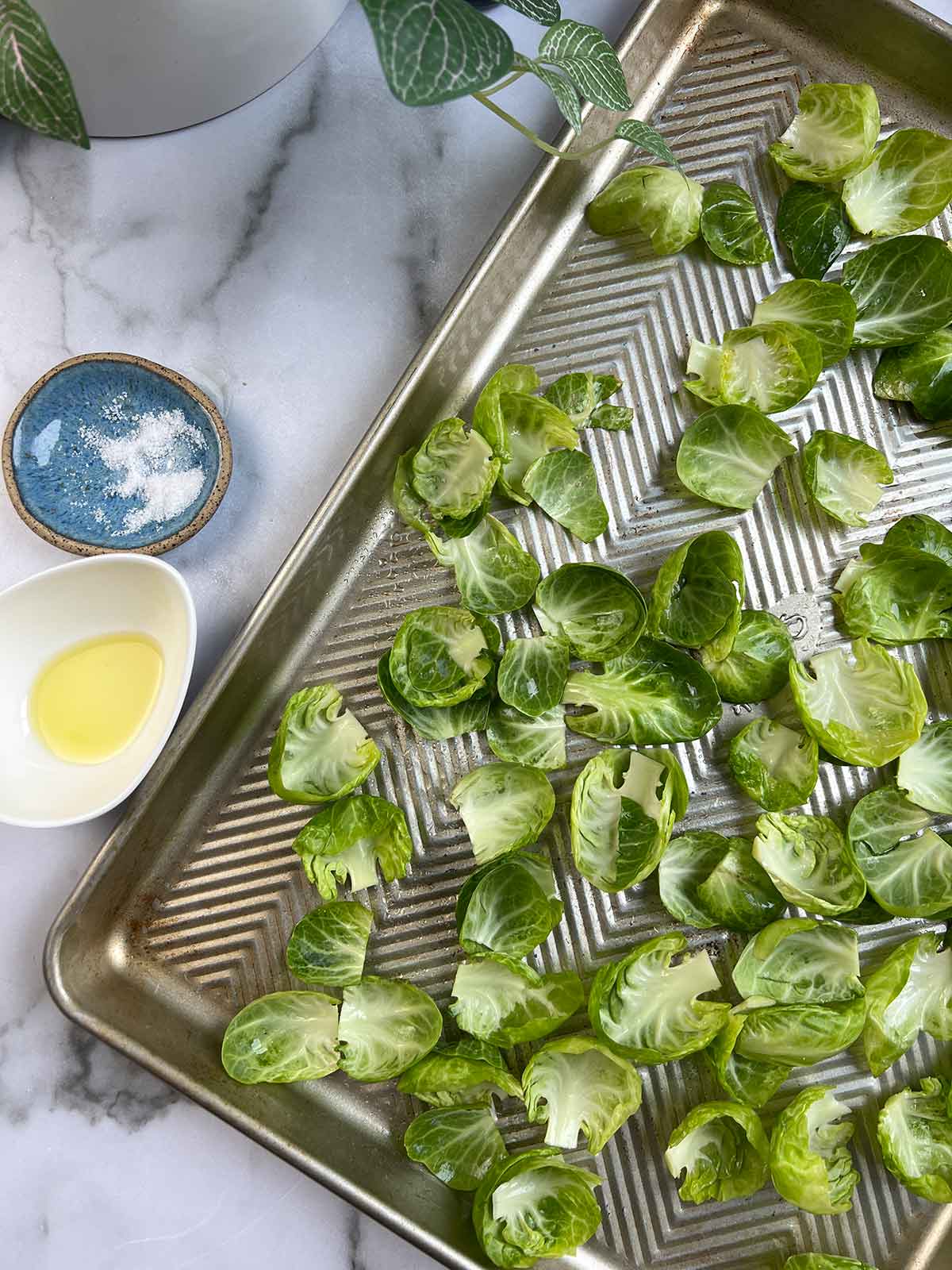 brussels sprout leaves on cooking sheet